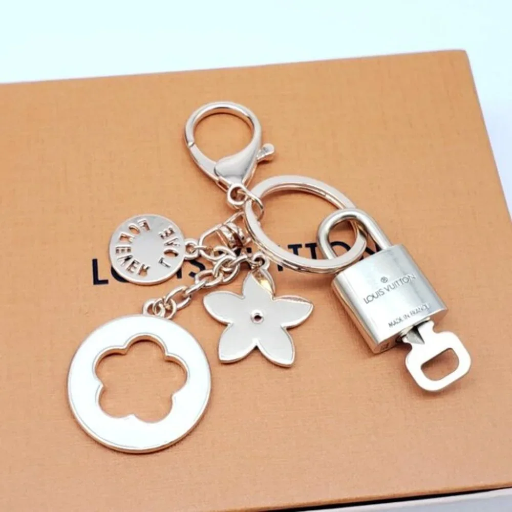 Authentic Louis Vuitton Gold Lock & Box w/ Unbranded Flower Bagcharm 120825